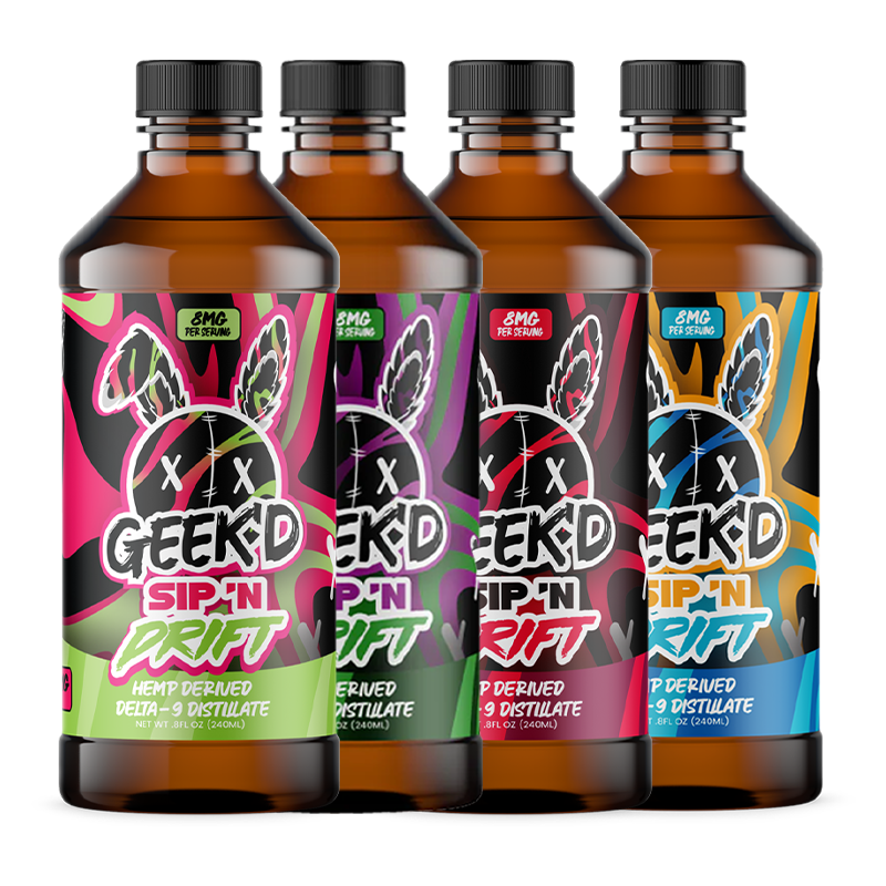 Geek'd SIP 'N DRIFT Delta-9 Distillate bottles featuring vibrant tropical flavors: Caribbean Blast, Cran Razz, Grape Apple, and Kiwi Strawberry.